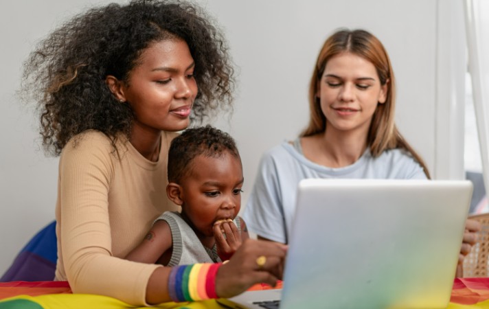 female couple with adopted baby